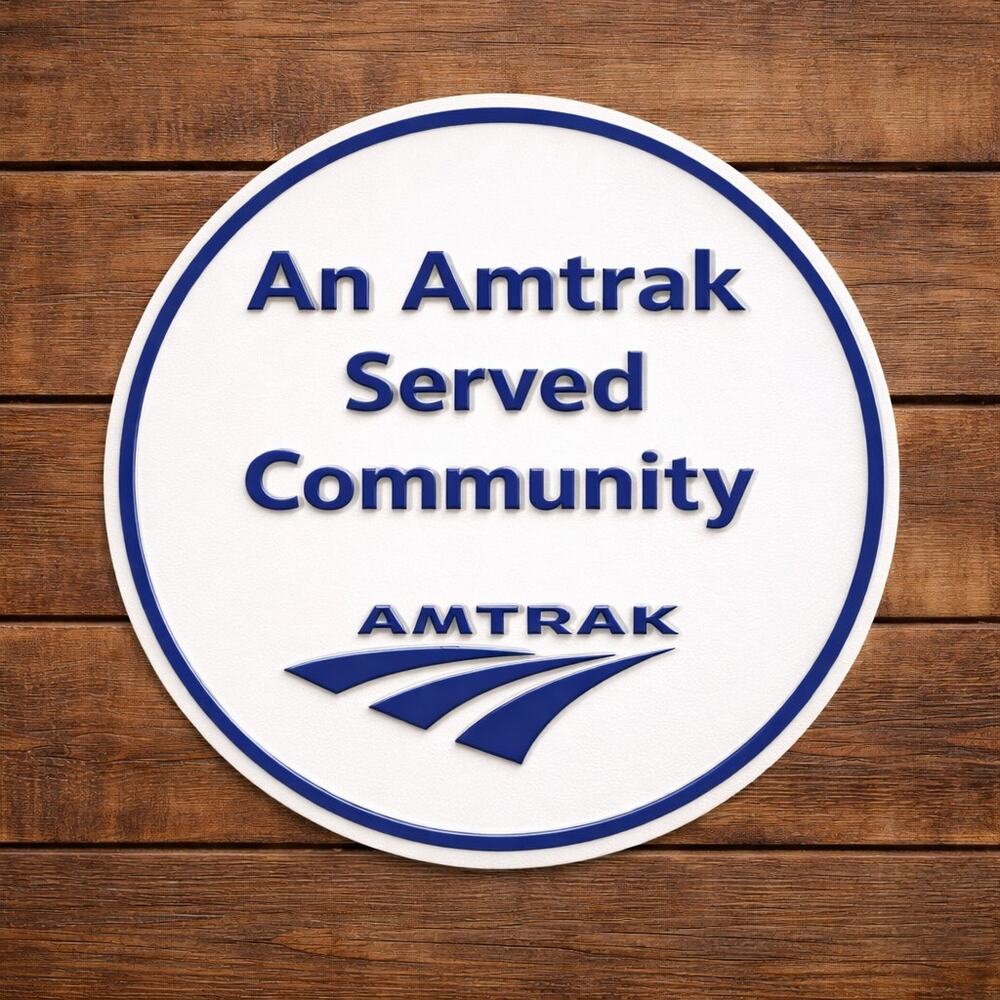 An Amtrak Served Community Sign Railroad Rail Passenger Travel USA Railway